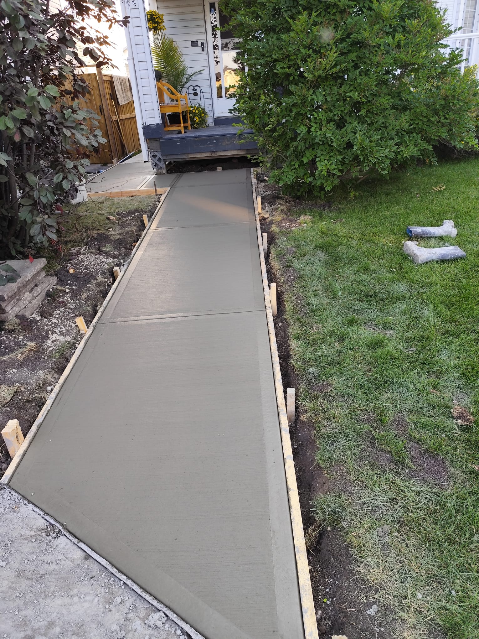 Completed residential front entrance concrete walkway Calgary