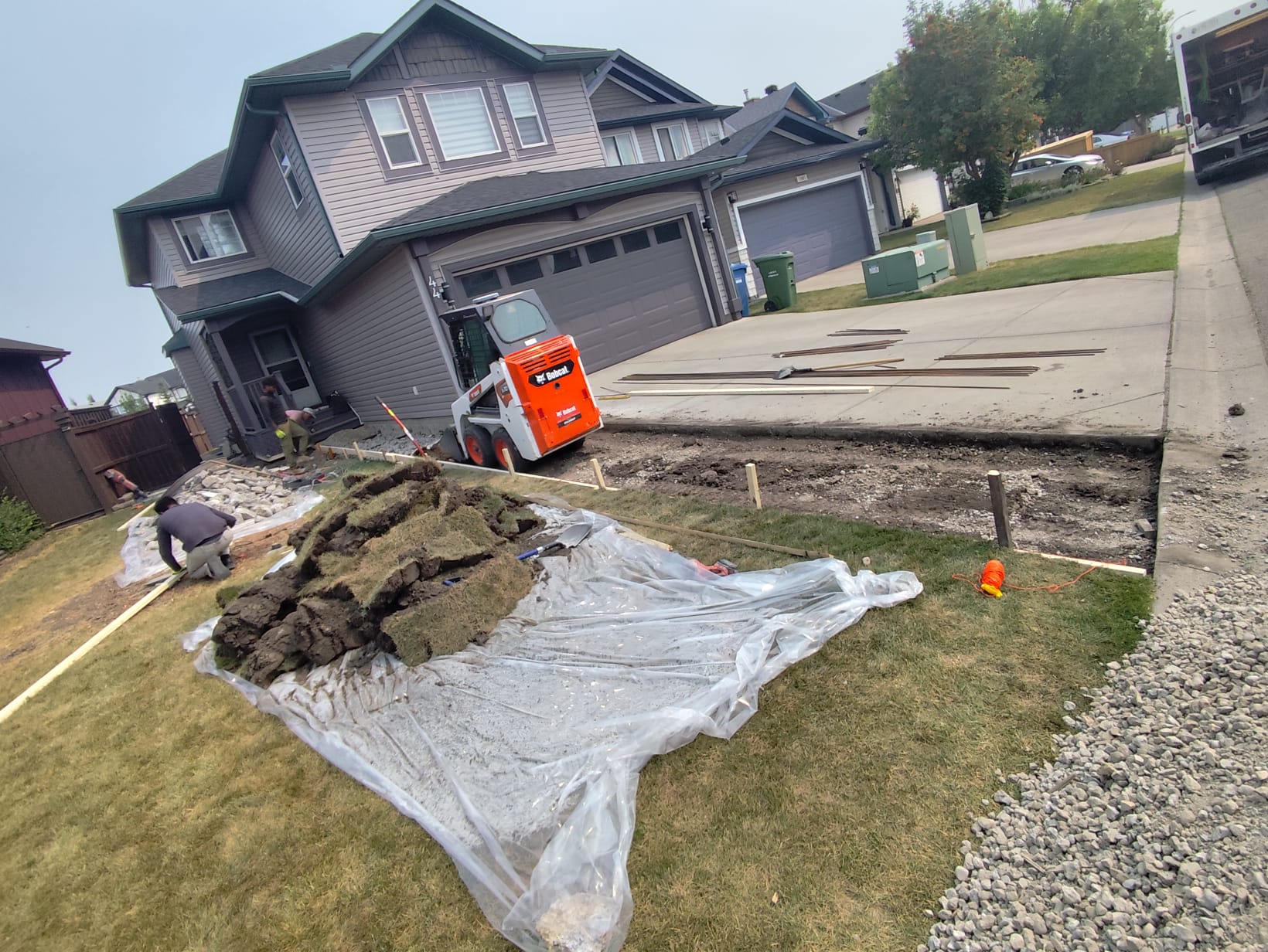 Bobcat excavation and subgrade prep for driveway Calgary